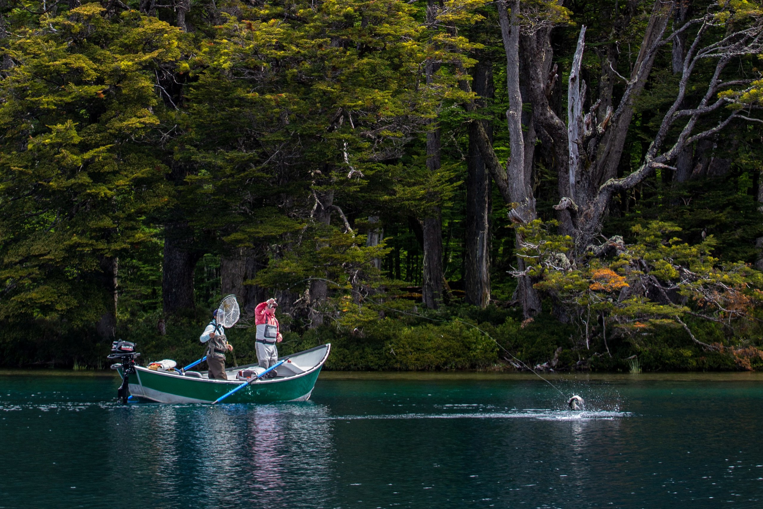 Two men fishing on a boat in Chile.
